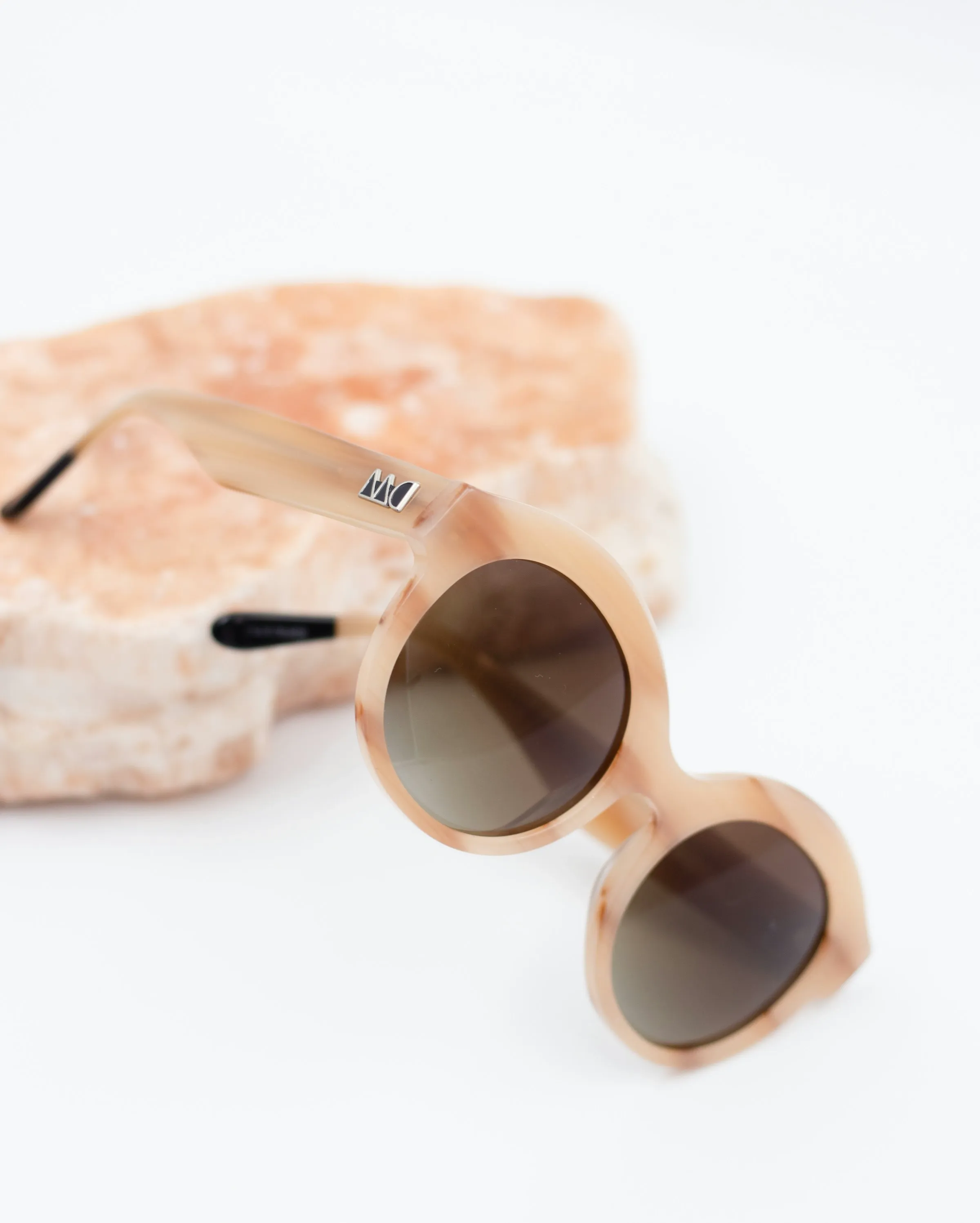 Original product photo of round tortoiseshell sunglasses on a white background