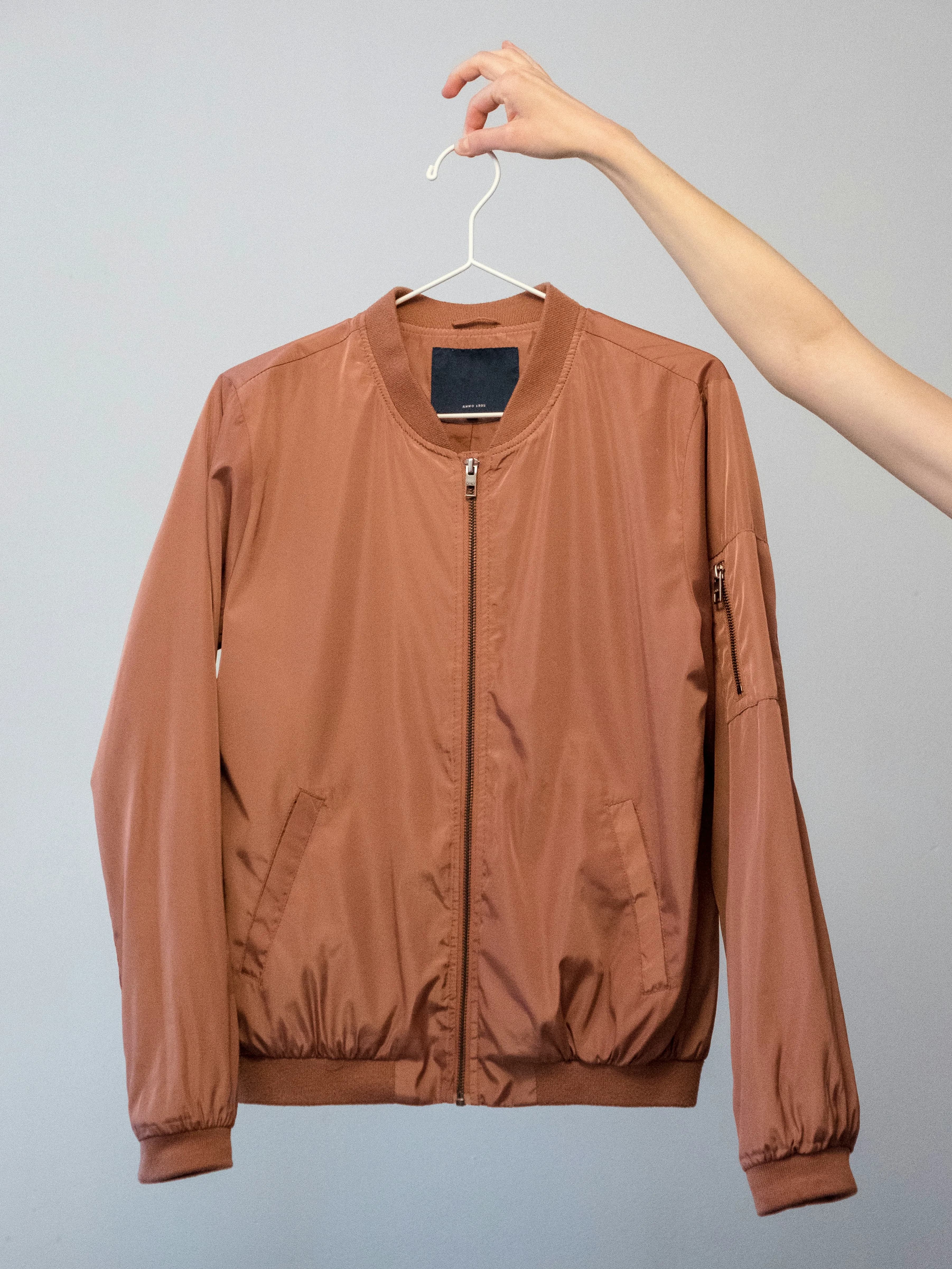 Original plain product photo of a bomber jacket on white background